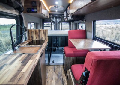 The Pisca - Sprinter 144" 4x4 for sale. Main living with countertop extended.